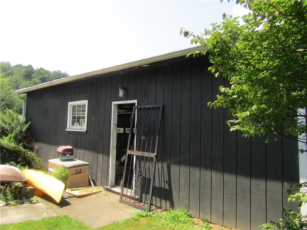 174 Juniata Road Dunbar, PA 15431 - Photo 4 of 12 a backyard of a house with table and chairs