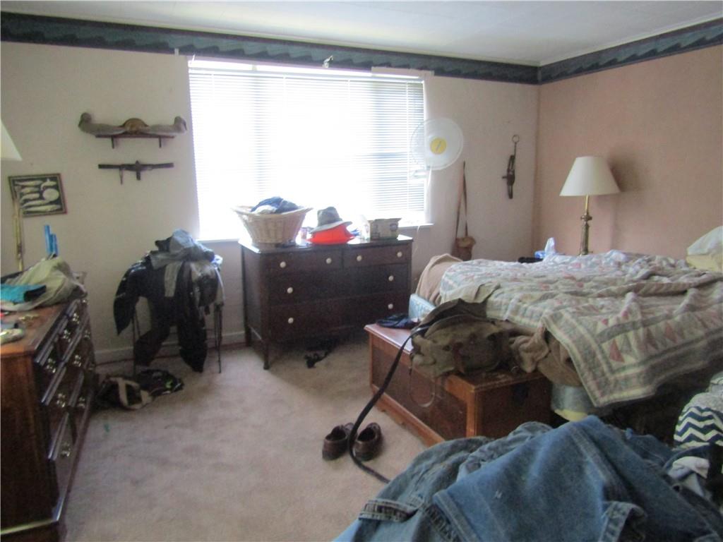 174 Juniata Road Dunbar, PA 15431 - Photo 6 of 12 a bedroom with a bed and a desk