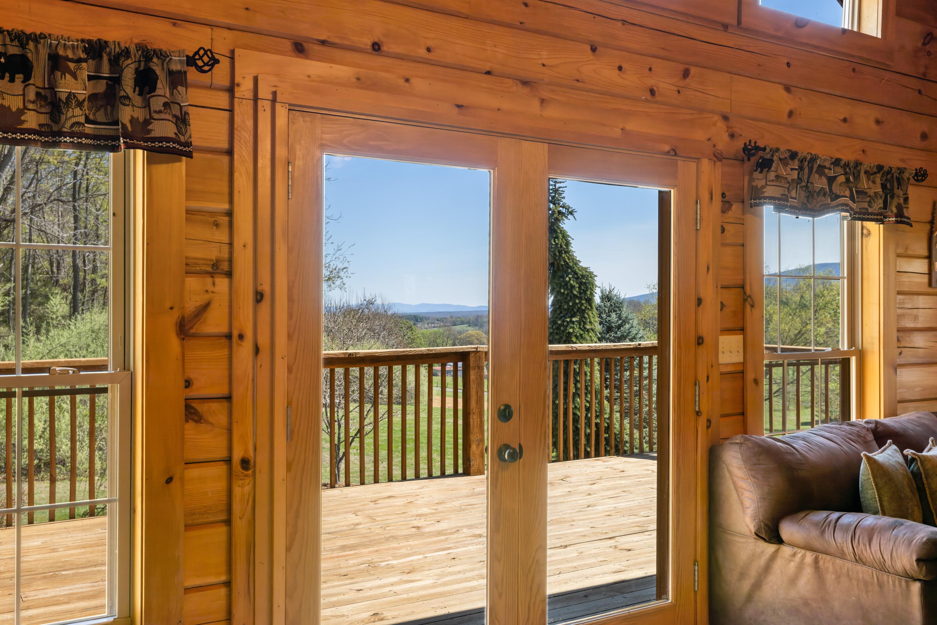 115 Spring Crossing Lane Steeles Tavern, VA 24476 - Photo 16 of 74 a balcony view with a couch