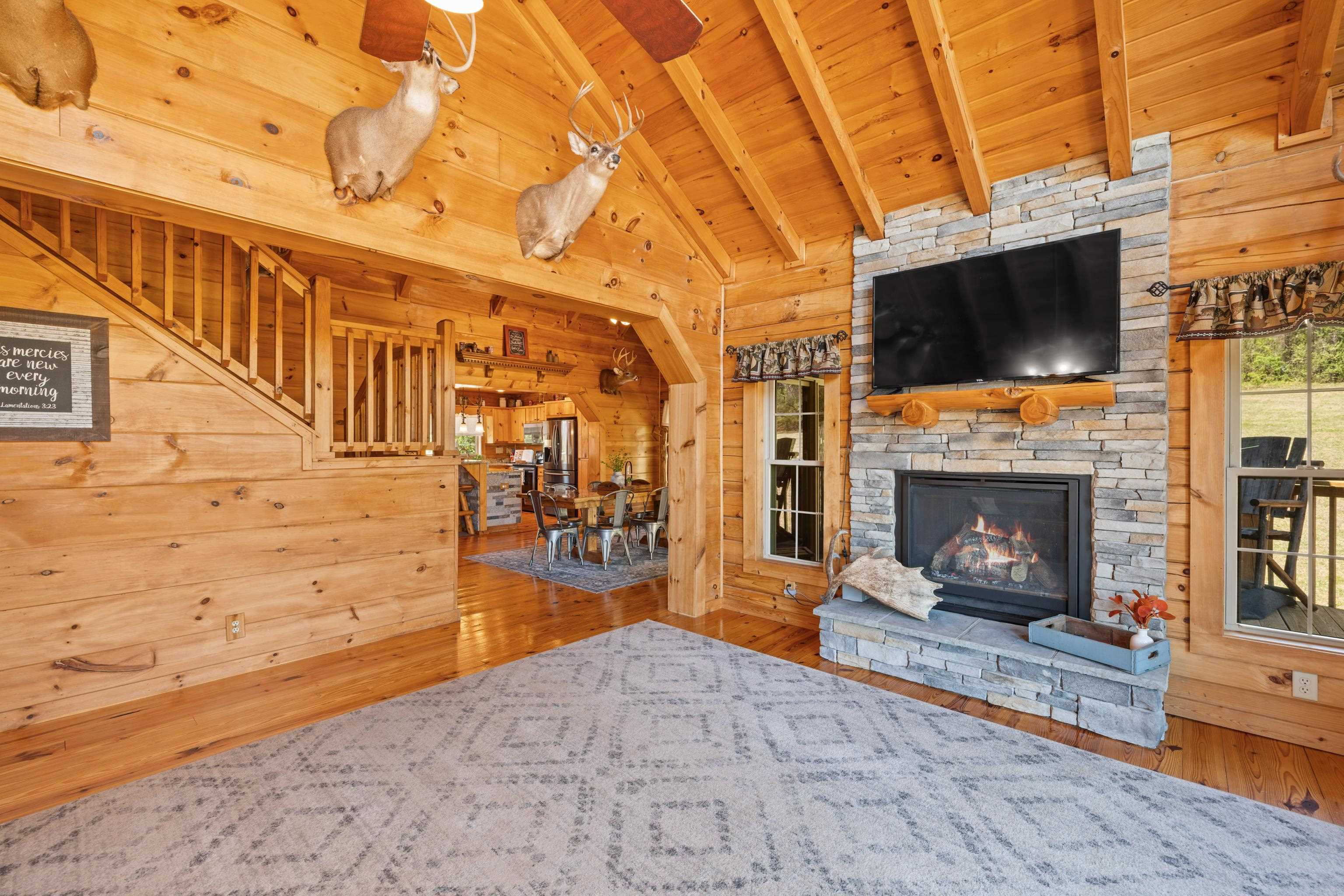 115 Spring Crossing Lane Steeles Tavern, VA 24476 - Photo 20 of 74 a view of a porch with a fireplace