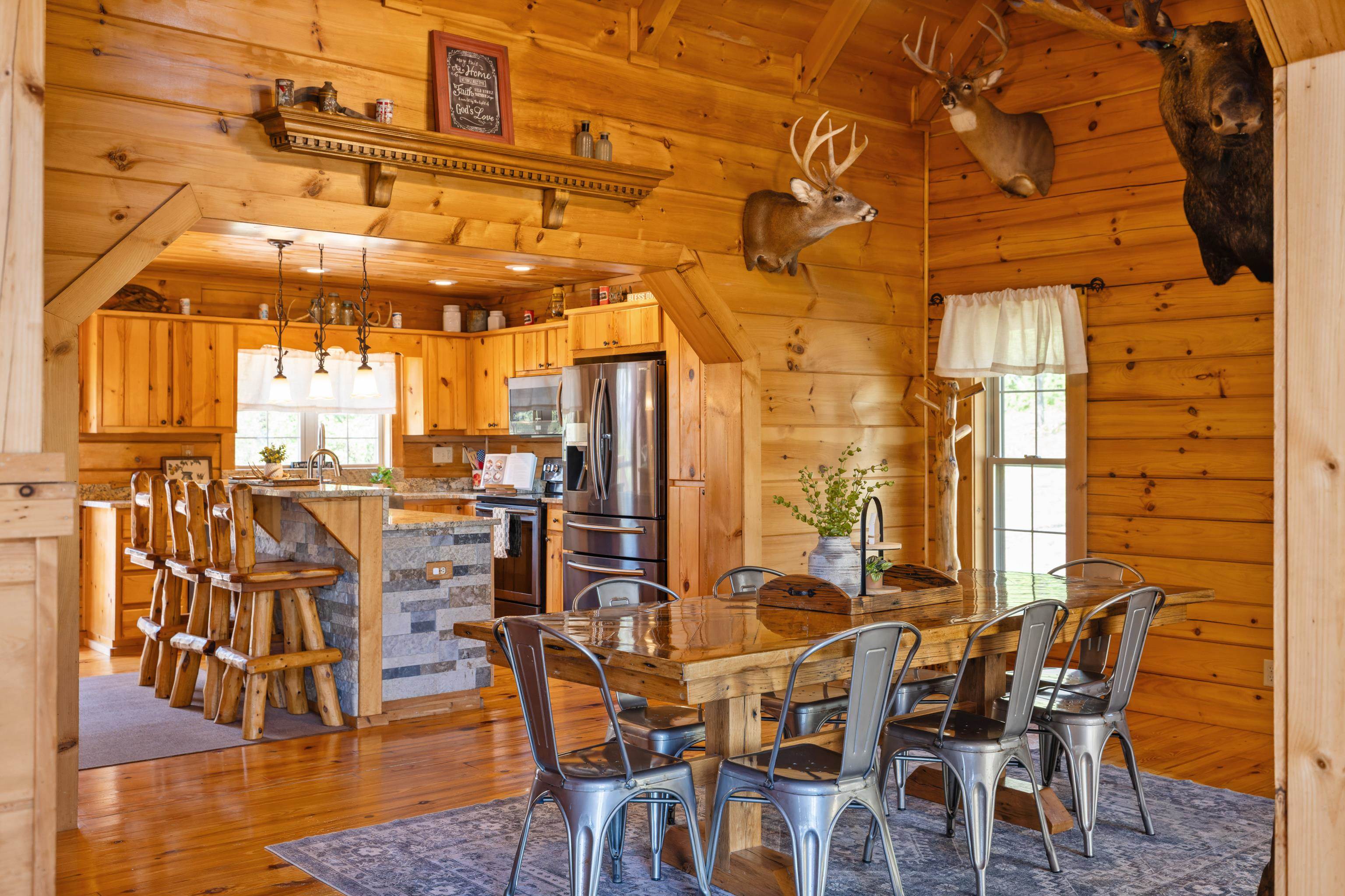 115 Spring Crossing Lane Steeles Tavern, VA 24476 - Photo 21 of 74 a view of a dining room with furniture and wooden floor
