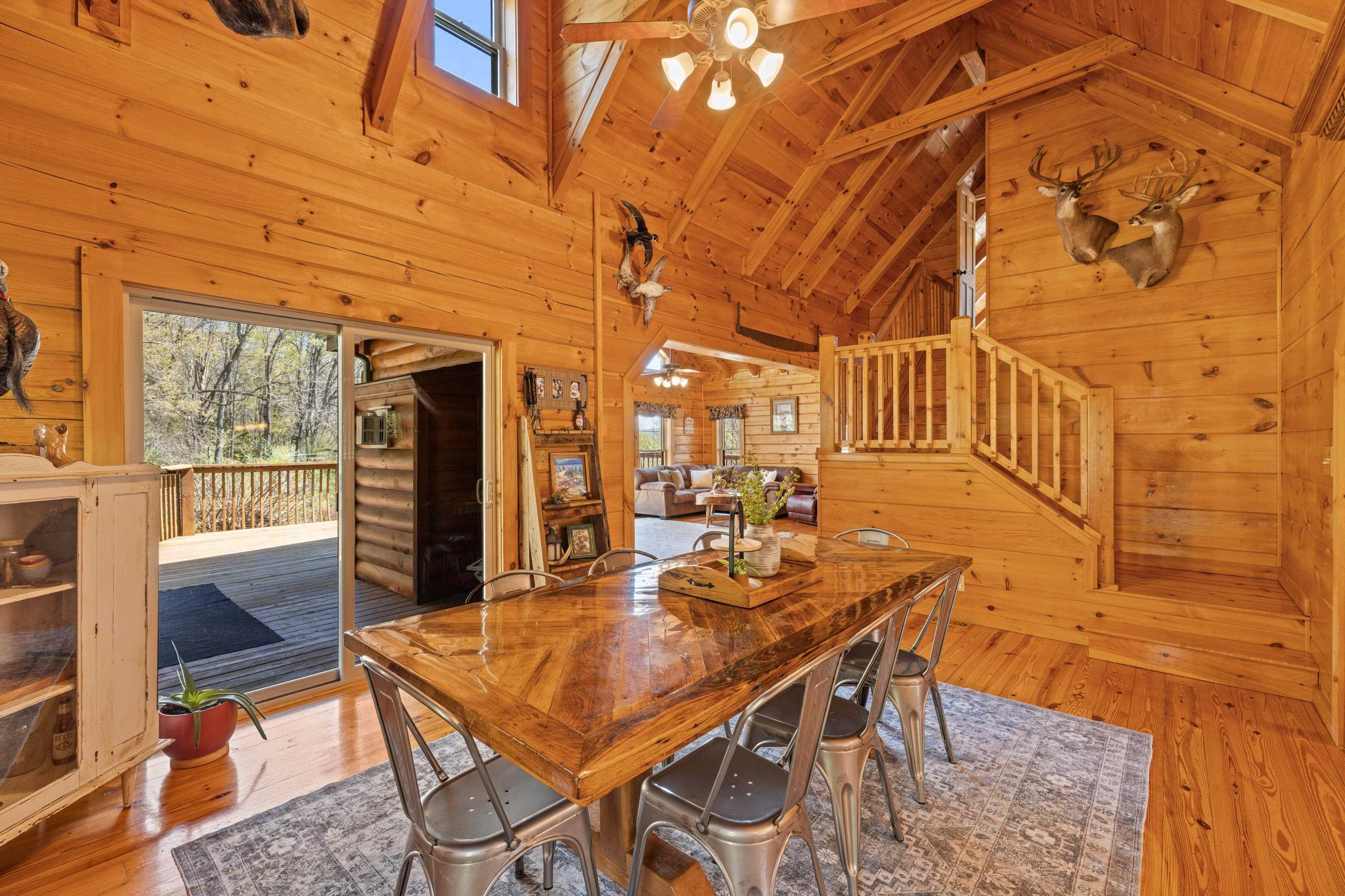 115 Spring Crossing Lane Steeles Tavern, VA 24476 - Photo 23 of 74 a view of a dining room with furniture and a table