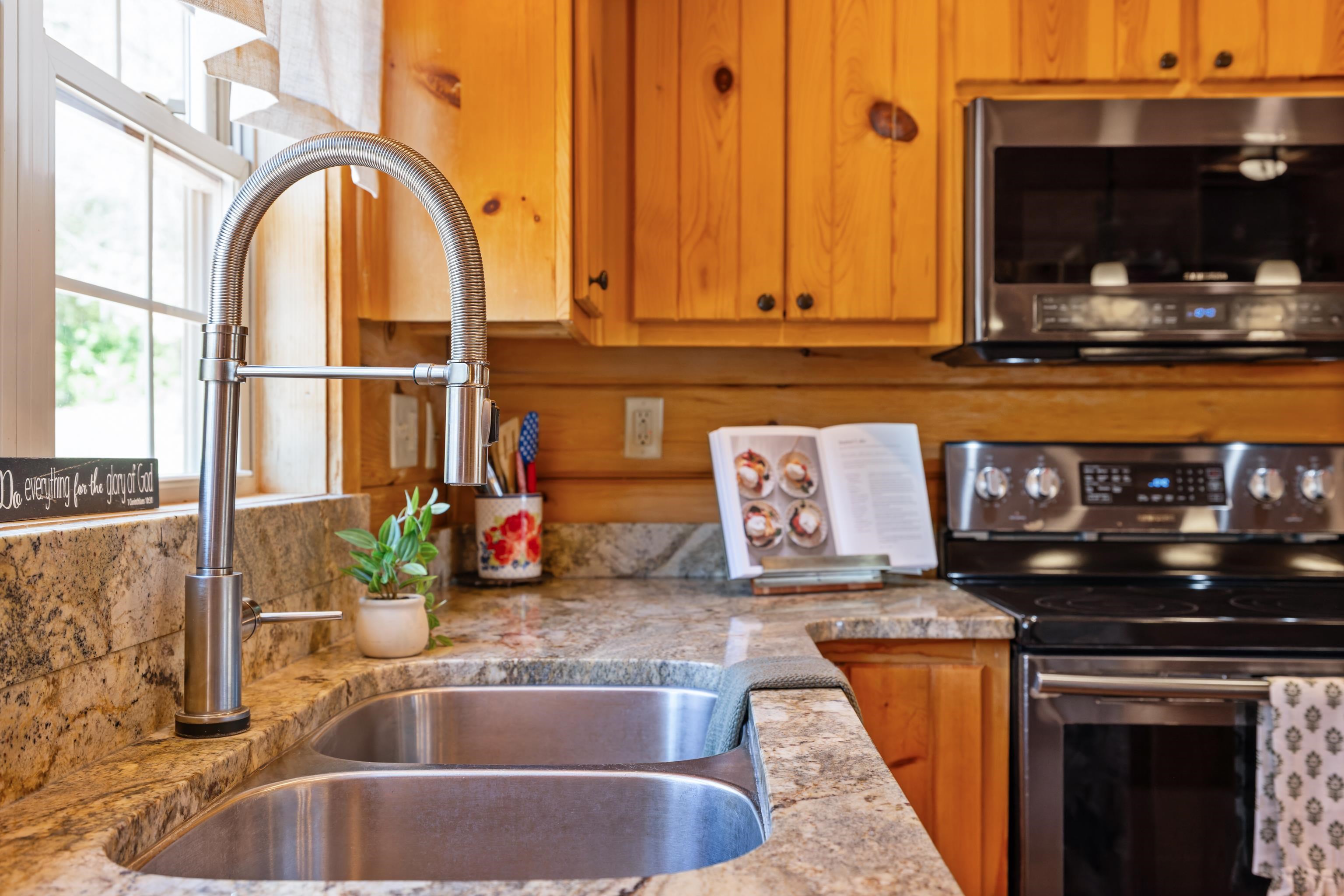115 Spring Crossing Lane Steeles Tavern, VA 24476 - Photo 29 of 74 a kitchen with a sink and a microwave