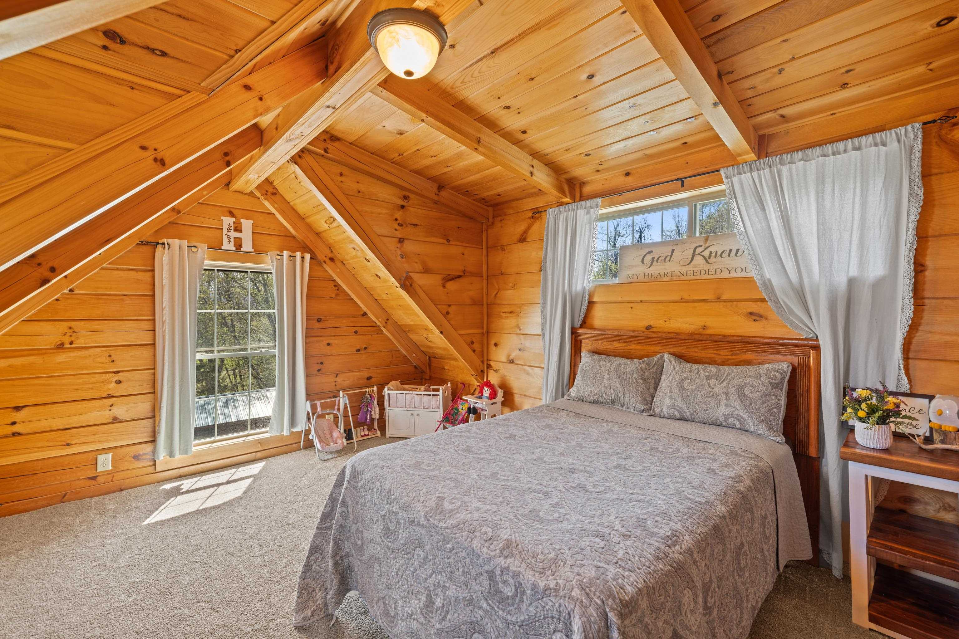115 Spring Crossing Lane Steeles Tavern, VA 24476 - Photo 41 of 74 a bedroom with a bed and a large window