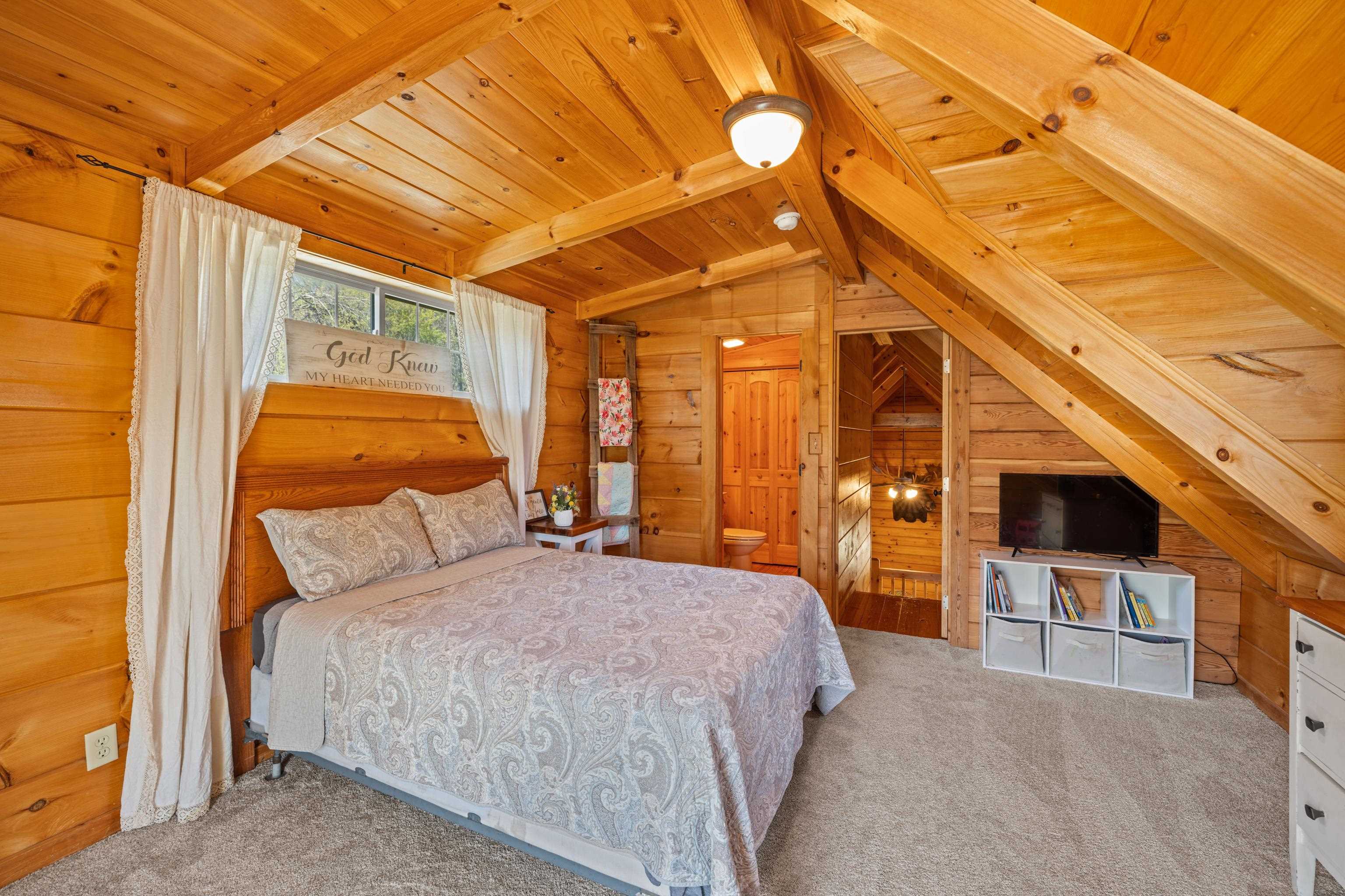 115 Spring Crossing Lane Steeles Tavern, VA 24476 - Photo 42 of 74 a bedroom with a bed and a tv