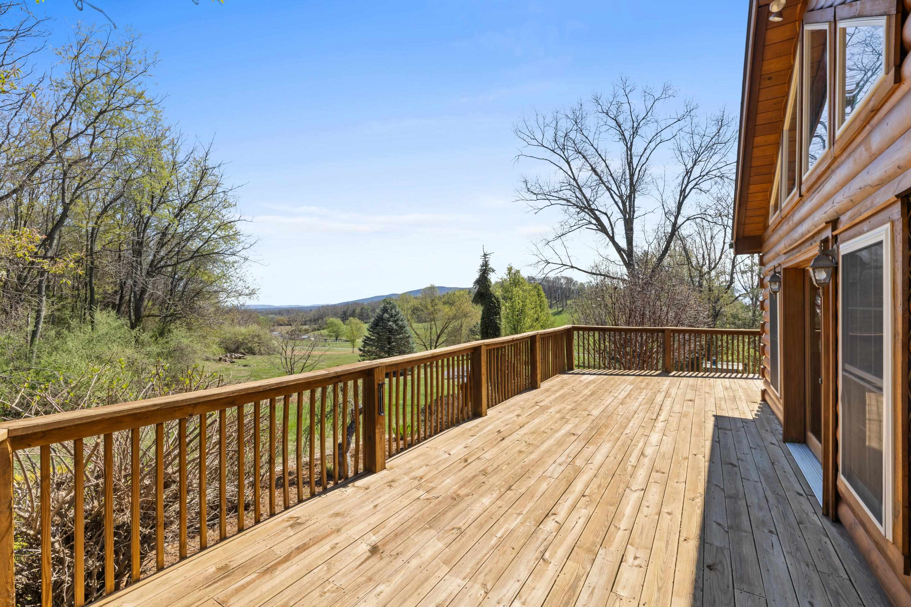115 Spring Crossing Lane Steeles Tavern, VA 24476 - Photo 50 of 74 a view of balcony with wooden floor and fence