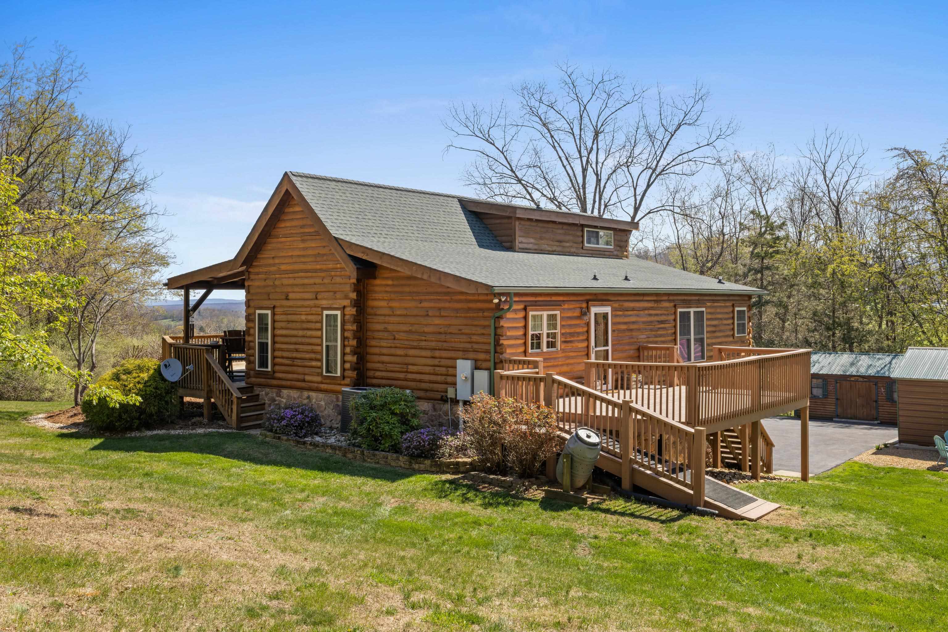 115 Spring Crossing Lane Steeles Tavern, VA 24476 - Photo 53 of 74 a view of a house with a yard