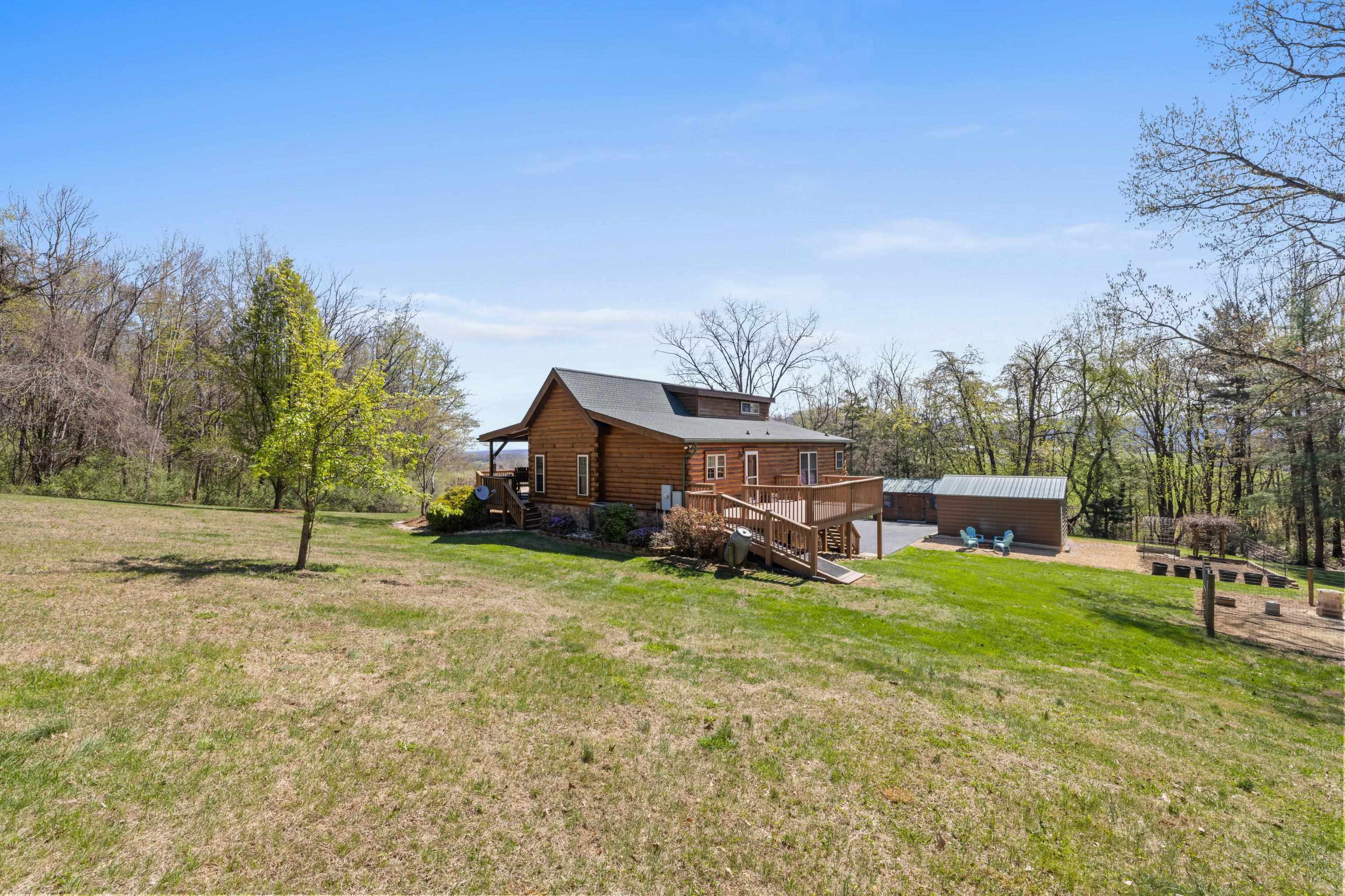 115 Spring Crossing Lane Steeles Tavern, VA 24476 - Photo 54 of 74 a view of a house with a yard