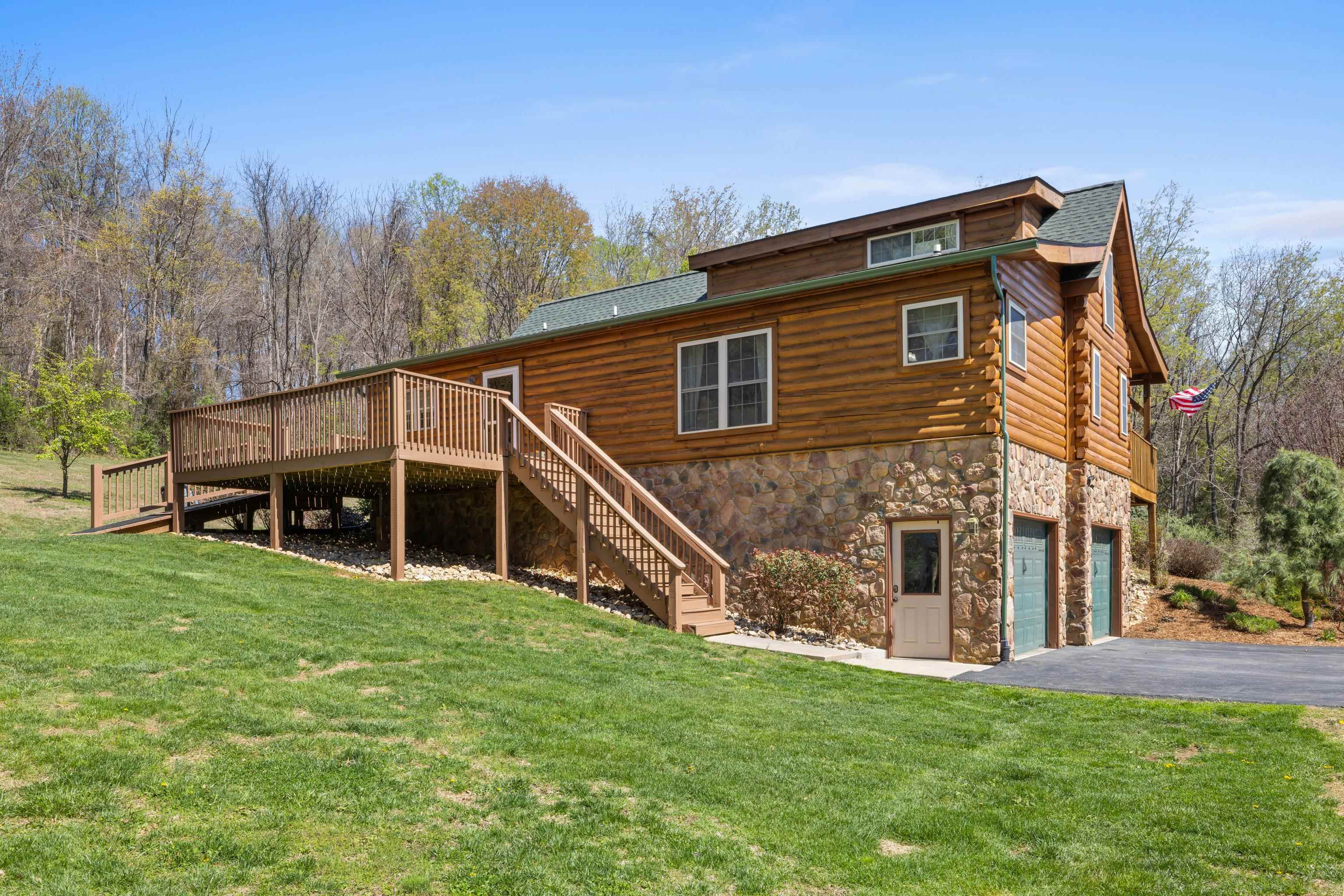 115 Spring Crossing Lane Steeles Tavern, VA 24476 - Photo 59 of 74 a view of a house with a yard
