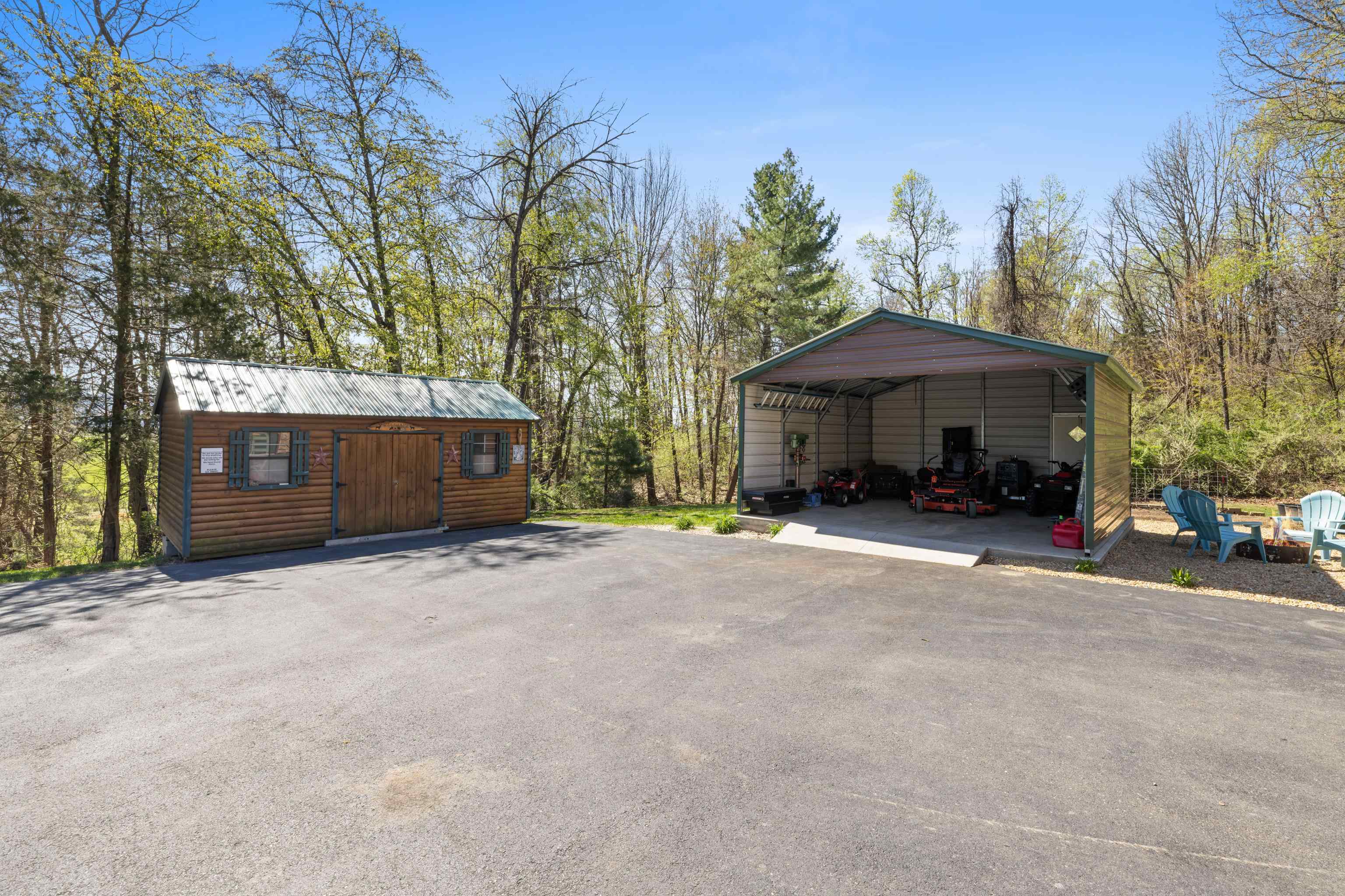 115 Spring Crossing Lane Steeles Tavern, VA 24476 - Photo 62 of 74 a view of a house with a yard and garage