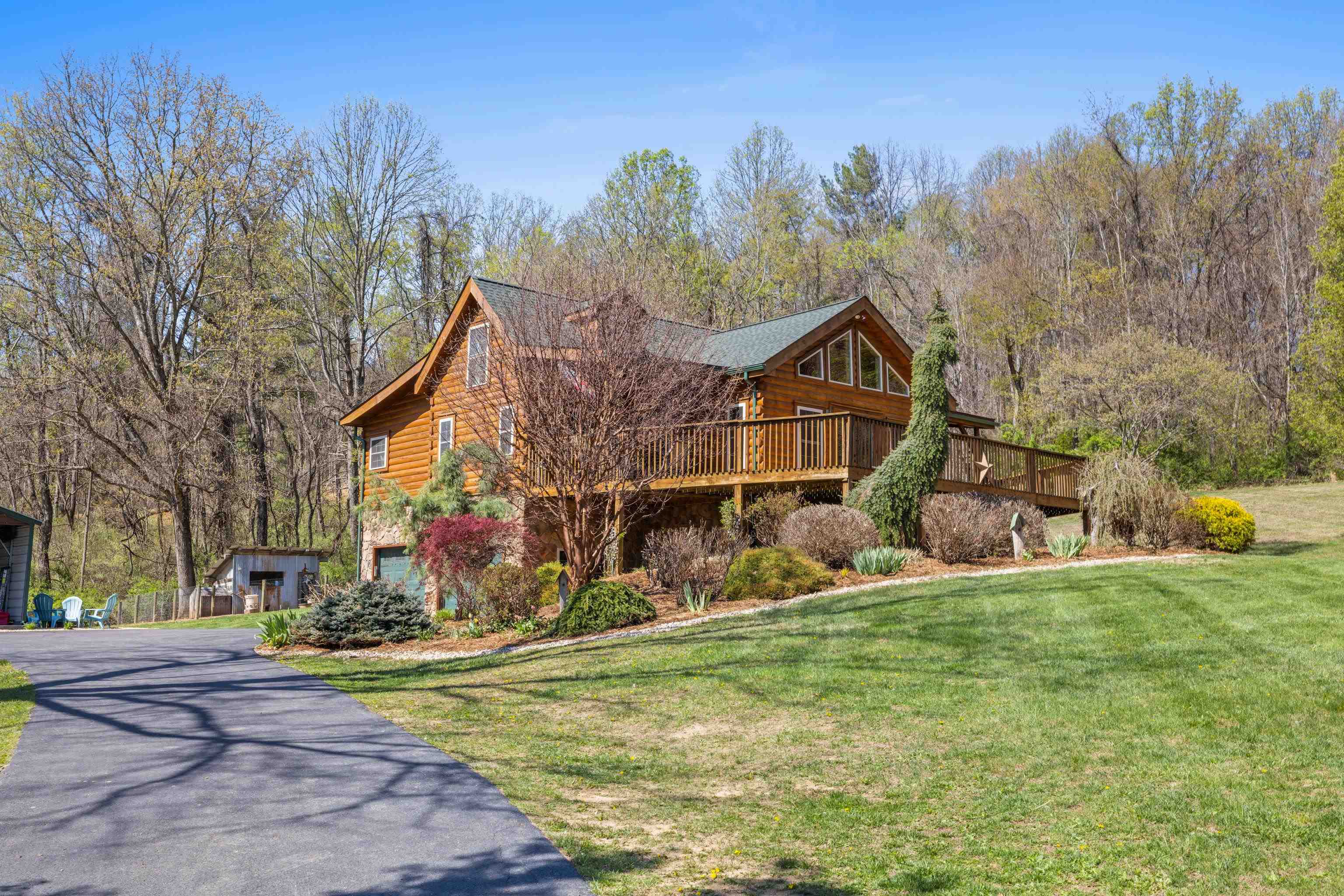 115 Spring Crossing Lane Steeles Tavern, VA 24476 - Photo 7 of 74 a front view of a house with a yard