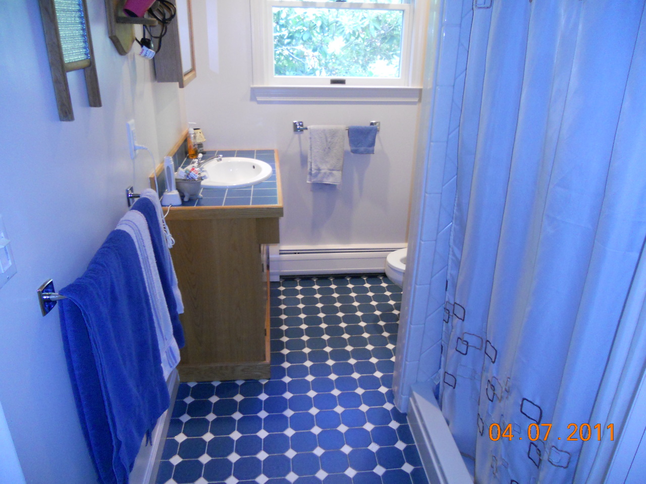 465 Brookman Road Pownal, VT 05261 - Photo 8 of 19 a bathroom with a sink a mirror and shower curtain