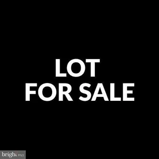 a sign on the wall next to a blue wall