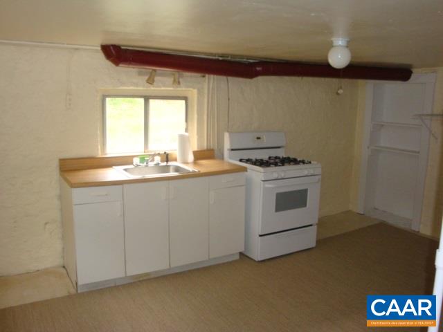 406 Harris Road Charlottesville, VA 22903 - Photo 11 of 13 a kitchen with a stove and a sink