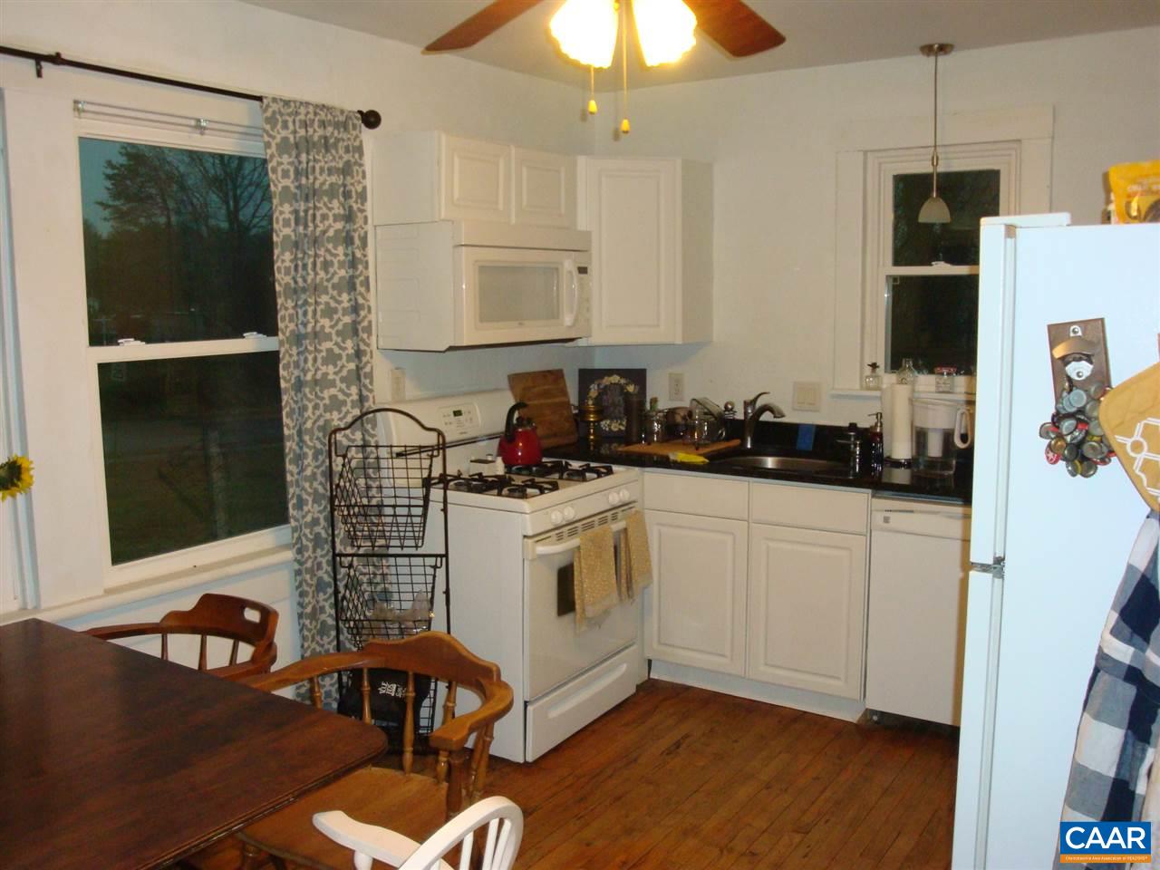 406 Harris Road Charlottesville, VA 22903 - Photo 2 of 13 a kitchen with stainless steel appliances a stove a sink and a refrigerator