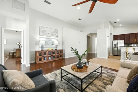 a living room with furniture and white walls