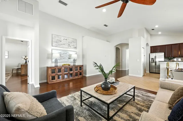 a living room with furniture and white walls