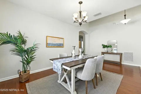 a bed room with a bed and a chair