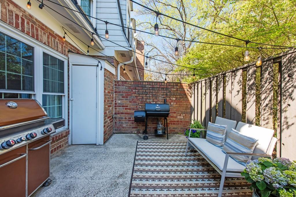 3 Surry County Place Northwest Atlanta, GA 30318 - Photo 31 of 50 a backyard of a house with outdoor seating