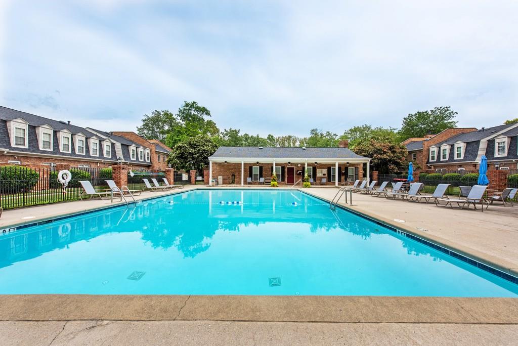 3 Surry County Place Northwest Atlanta, GA 30318 - Photo 46 of 50 a view of swimming pool with outdoor seating and a garden