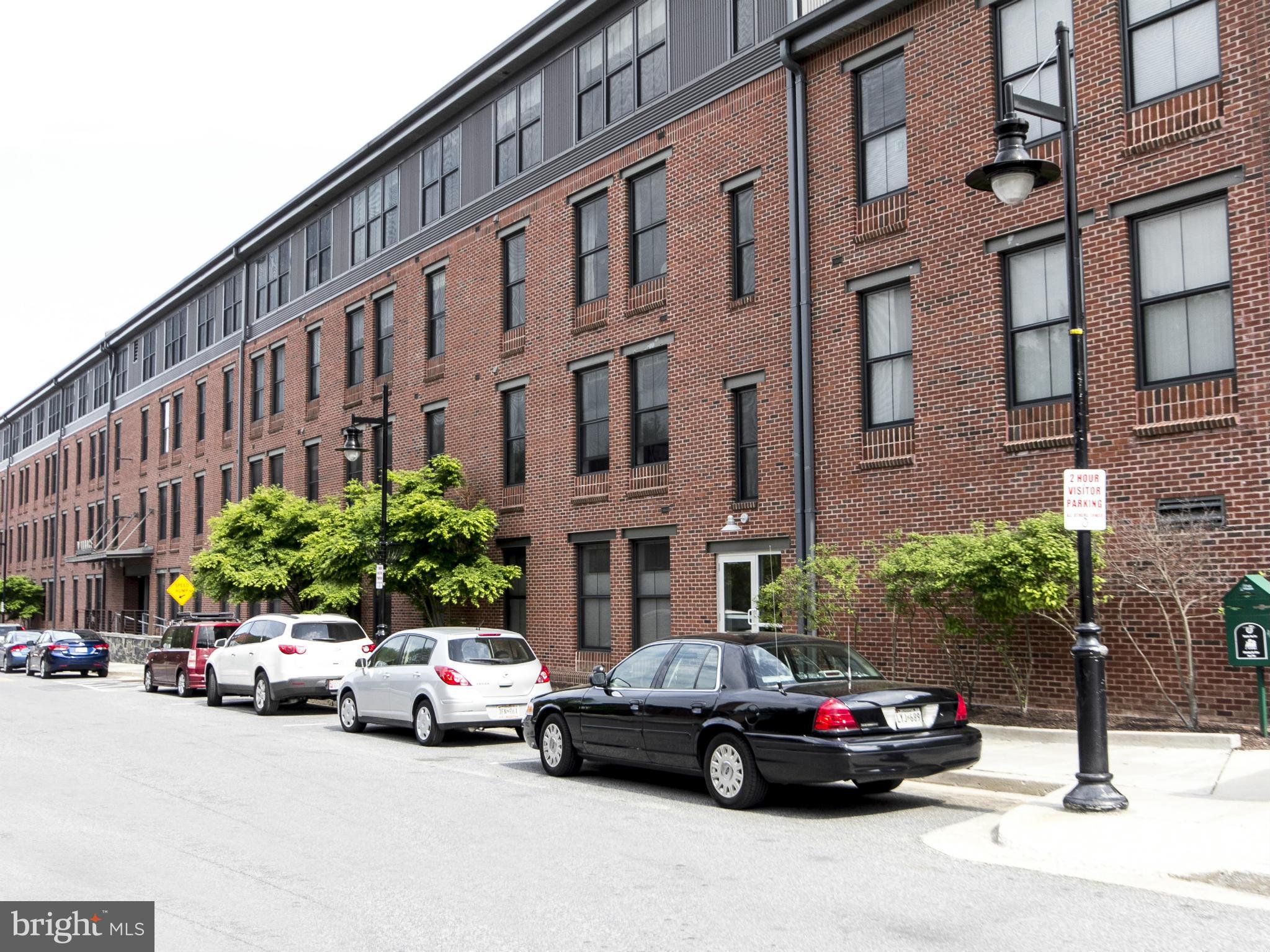 2007 Clipper Park Road, Unit 116 Baltimore, MD 21211 - Photo 1 of 30 a car parked in front of a building