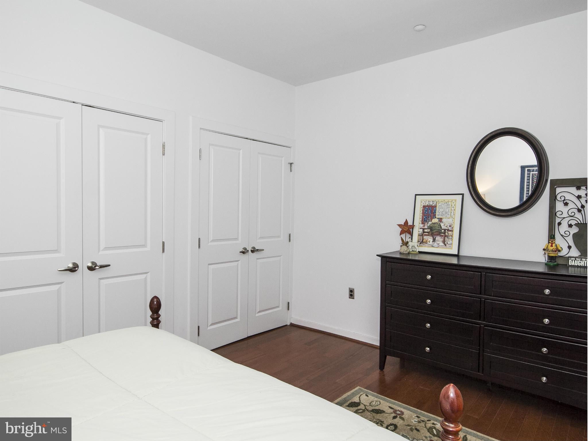 2007 Clipper Park Road, Unit 116 Baltimore, MD 21211 - Photo 12 of 30 a bedroom with a bed and a dresser