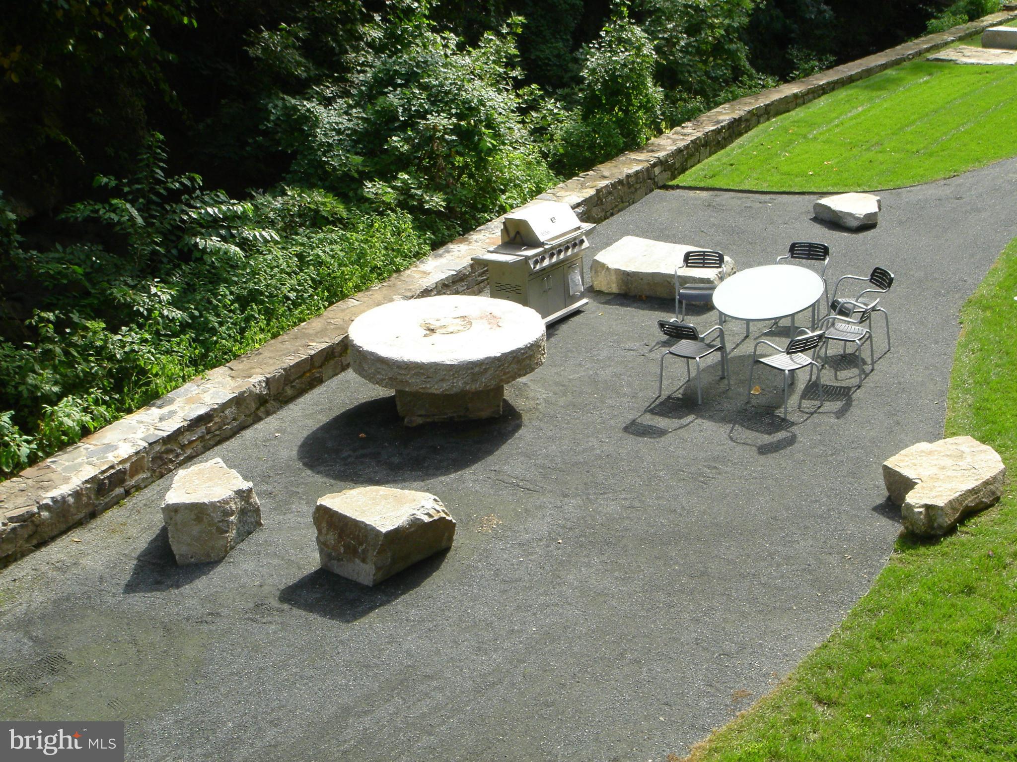 2007 Clipper Park Road, Unit 116 Baltimore, MD 21211 - Photo 22 of 30 a view of a chairs and table in backyard