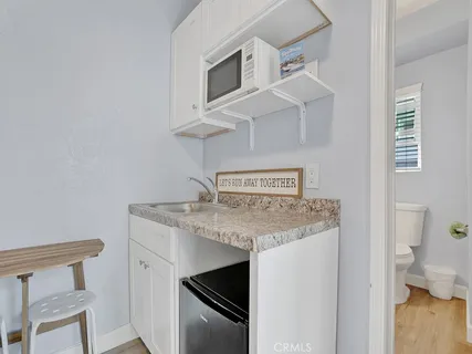 a kitchen with a stove and a microwave