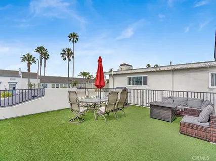 a view of a chairs and table in the patio