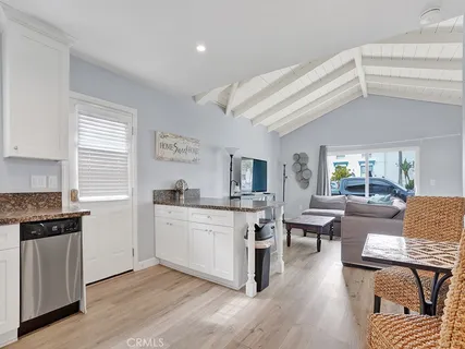a kitchen with stainless steel appliances granite countertop a stove and a refrigerator