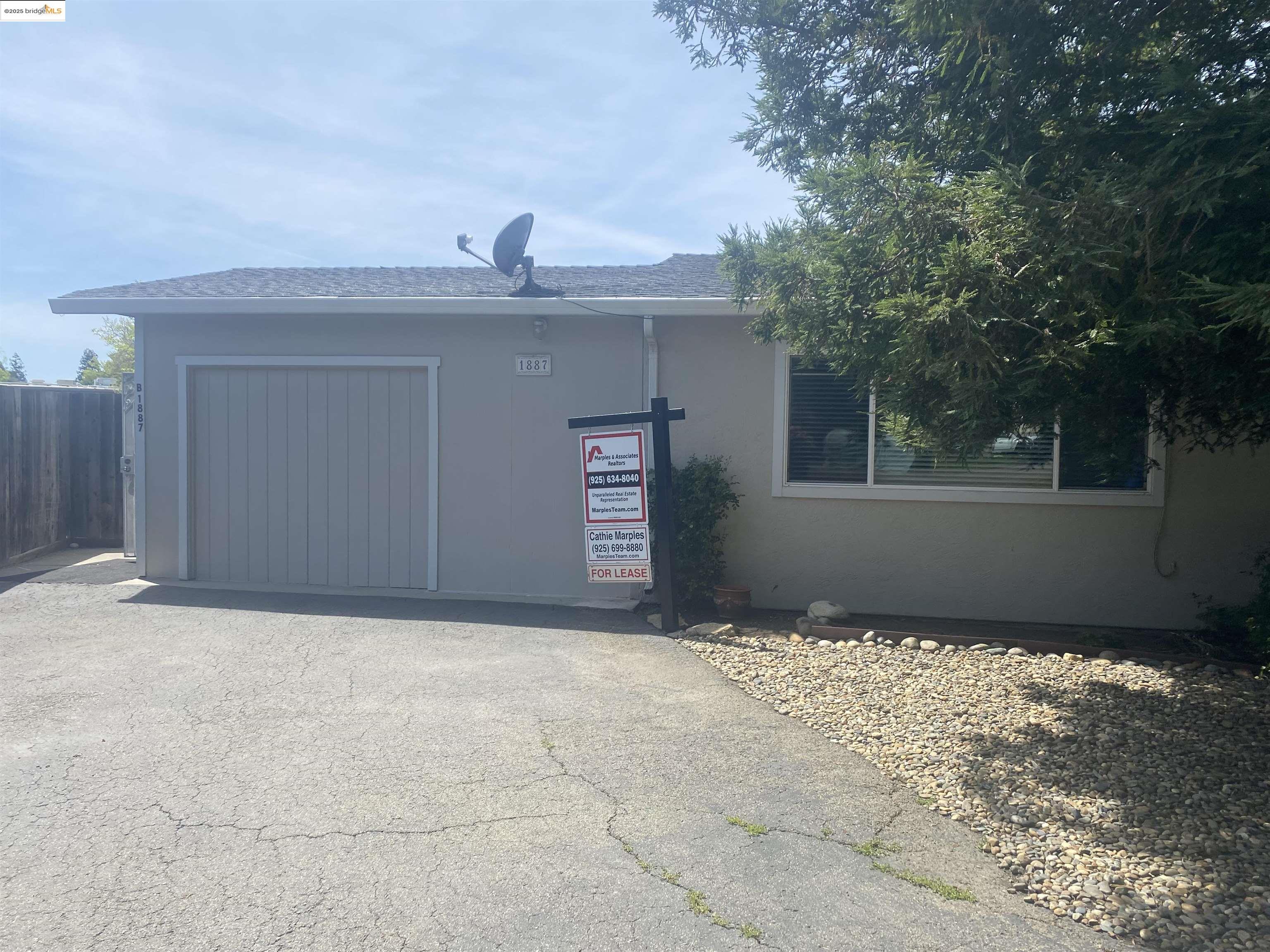 1887 Farm Bureau Road, Unit B Concord, CA 94519 - Photo 1 of 8 a view of an empty room with a garage