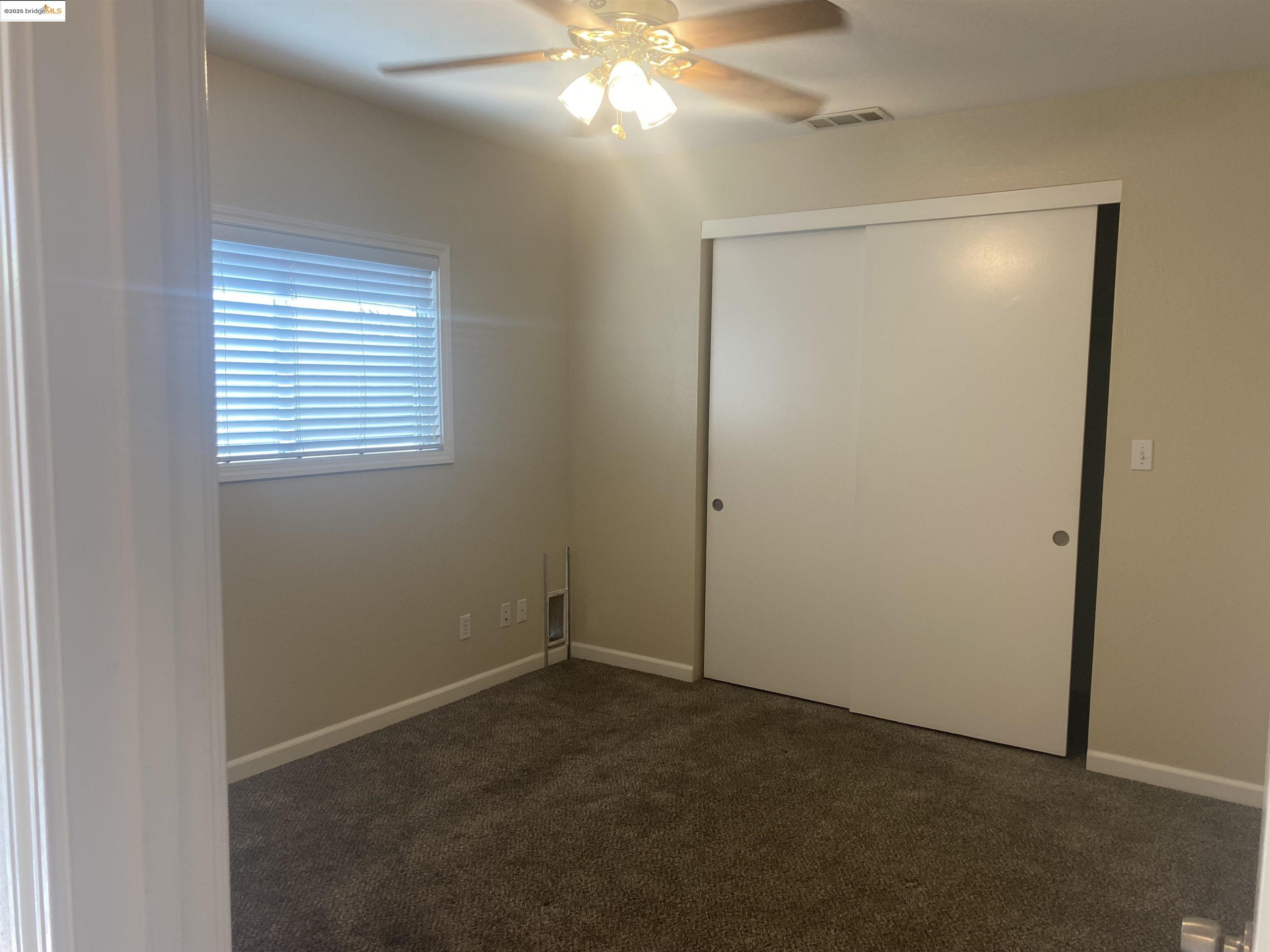 1887 Farm Bureau Road, Unit B Concord, CA 94519 - Photo 6 of 8 a view of a decorative light in a room next to a window