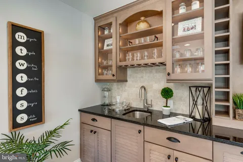 a kitchen with a sink and a stove