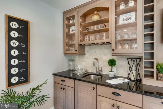a kitchen with a sink and a stove