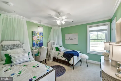 a bedroom with furniture and a window