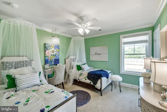 a bedroom with furniture and a window