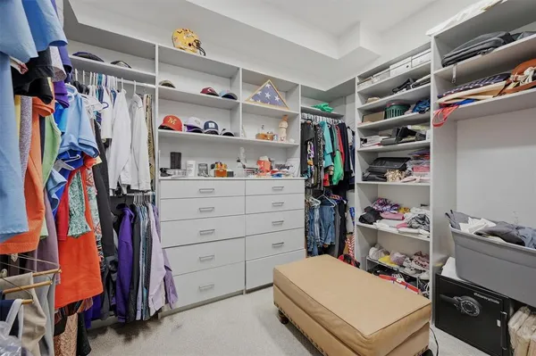 a bedroom with a bed and a desk