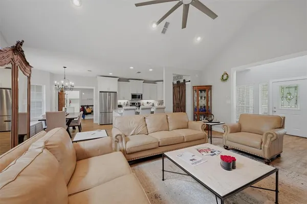 a living room with furniture or kitchen view and a couch