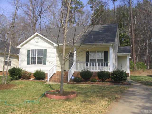 1407 Lenoir Street Raleigh, NC 27610 - Photo 1 of 5 a front view of a house with garden