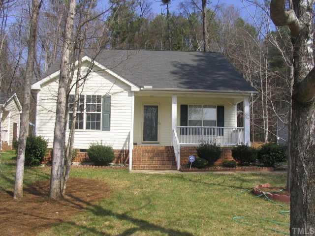 1407 Lenoir Street Raleigh, NC 27610 - Photo 2 of 5 a front view of a house with garden