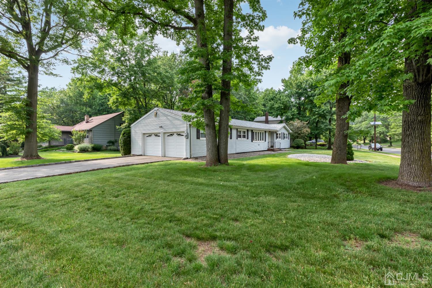 1 Greenwich Road Edison, NJ 08820 - Photo 3 of 26 a front view of a house with garden
