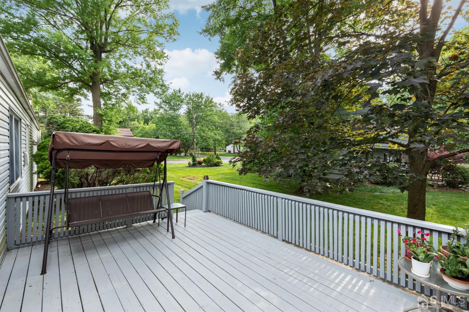 1 Greenwich Road Edison, NJ 08820 - Photo 6 of 26 a view of a deck with wooden floor and outdoor seating