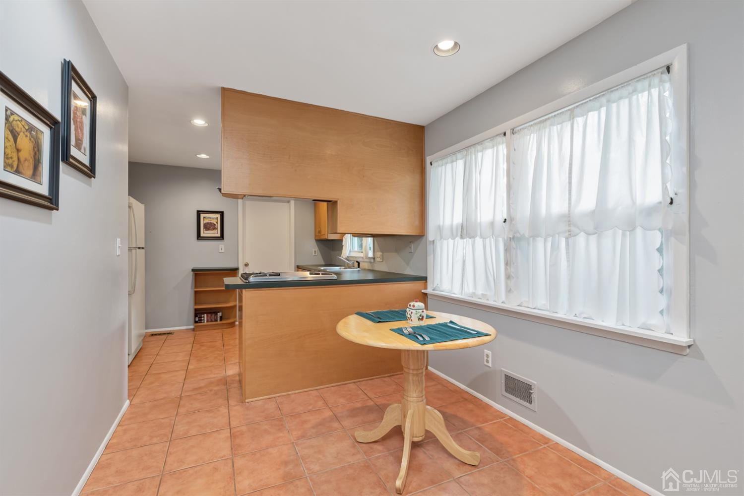 1 Greenwich Road Edison, NJ 08820 - Photo 10 of 26 a kitchen with a table and chairs in it