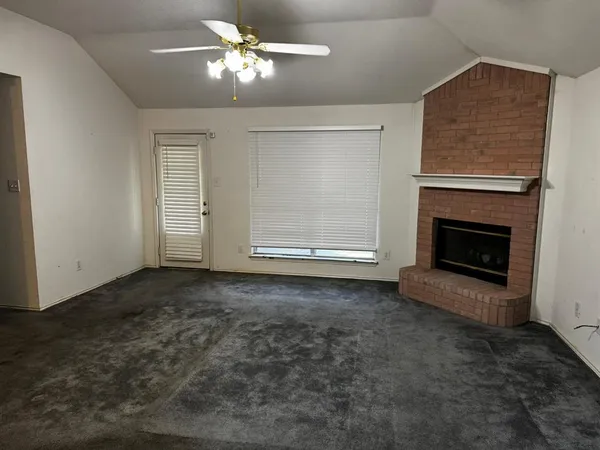 a kitchen with stainless steel appliances granite countertop a refrigerator and a stove