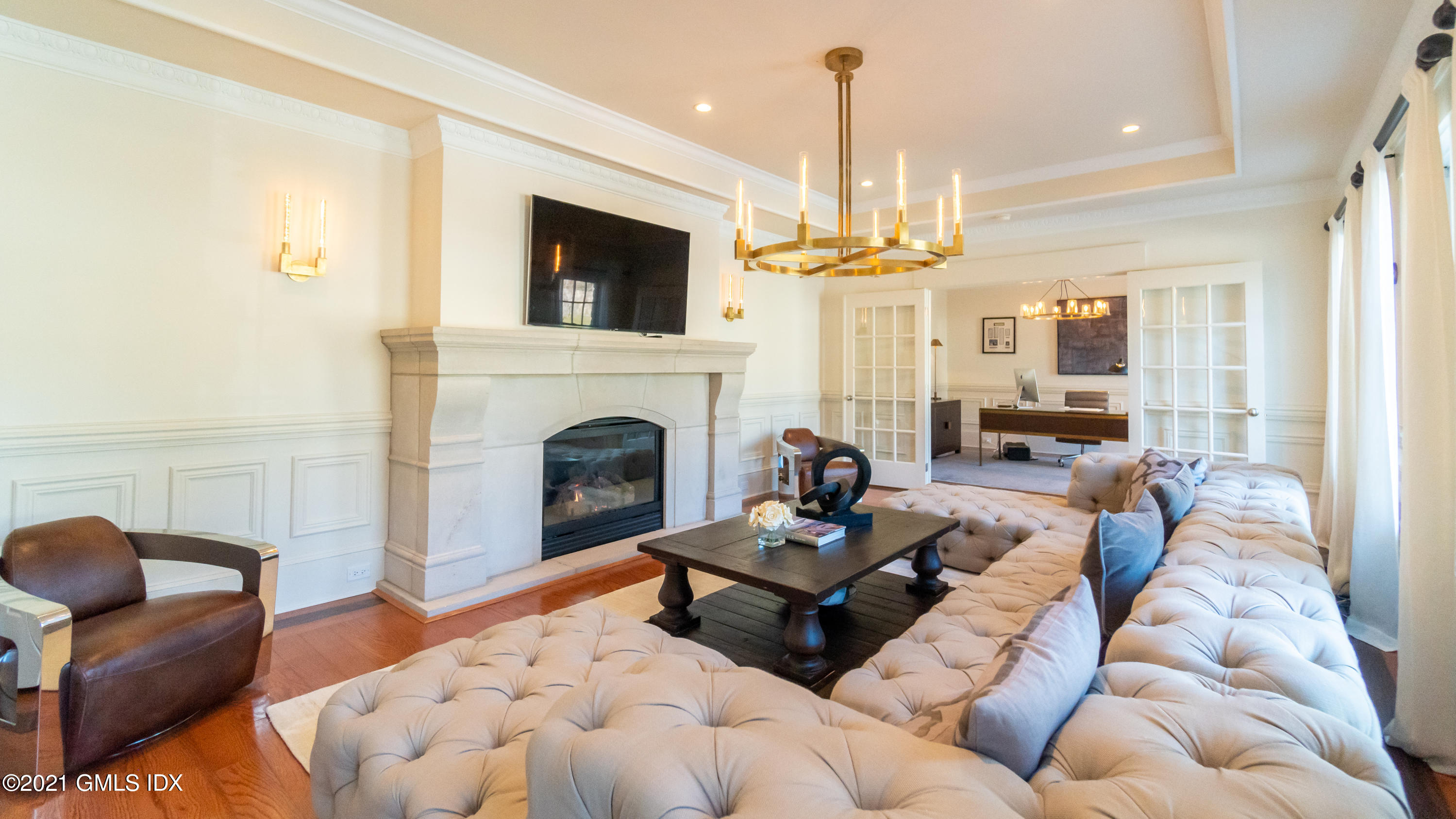 28 Dairy Road Greenwich, CT 06830 - Photo 11 of 23 a living room with furniture fireplace and flat screen tv