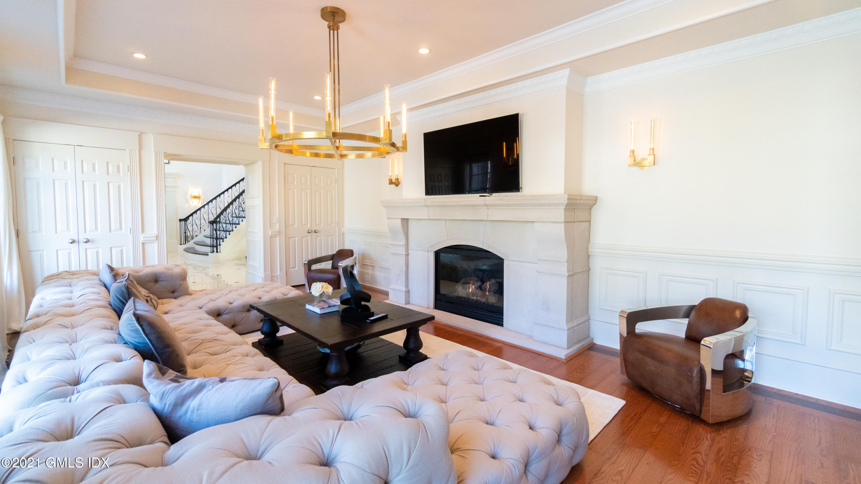 28 Dairy Road Greenwich, CT 06830 - Photo 12 of 23 a living room with furniture fireplace and flat screen tv