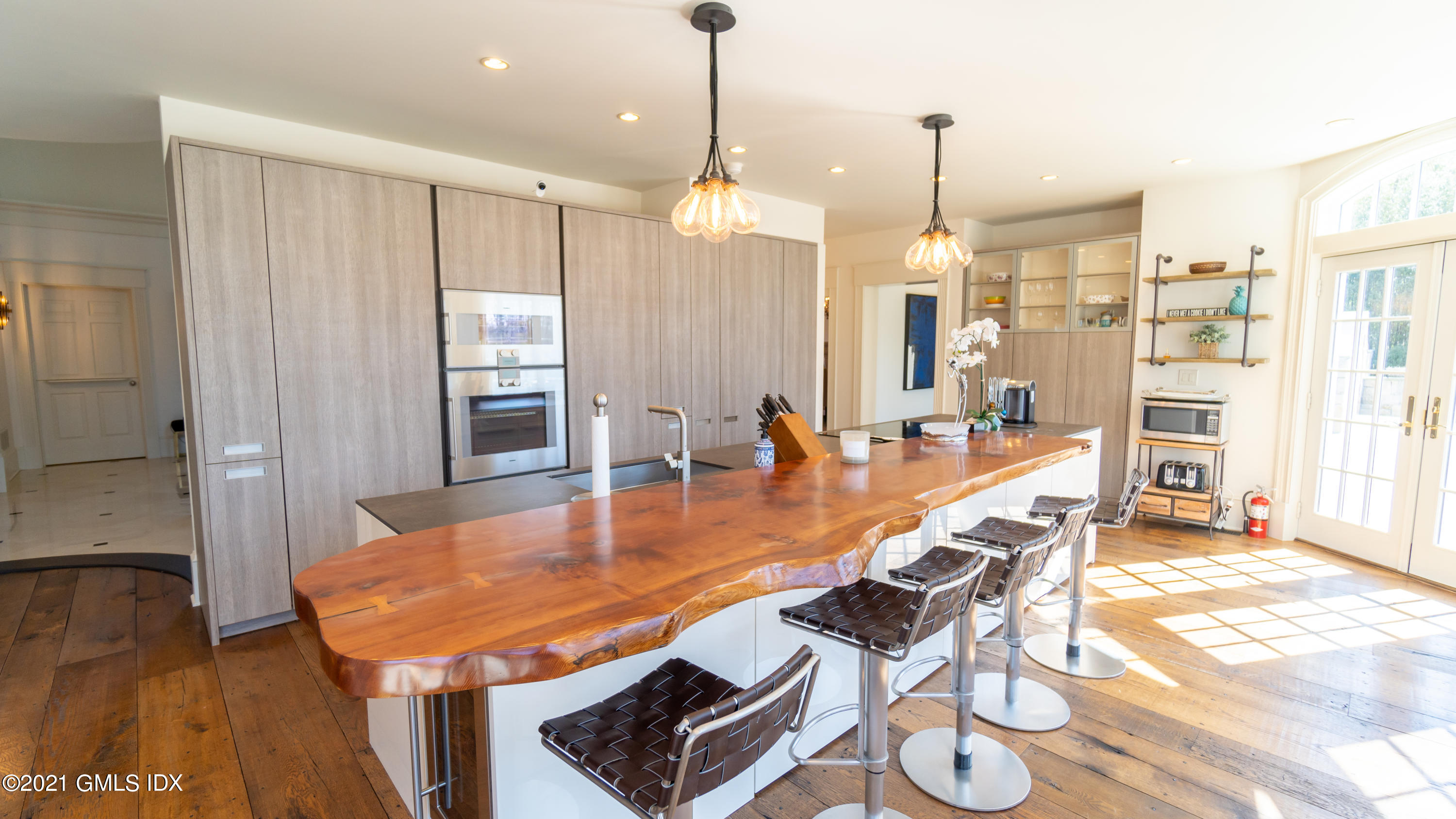 28 Dairy Road Greenwich, CT 06830 - Photo 14 of 23 a dining room with furniture a chandelier and wooden floor