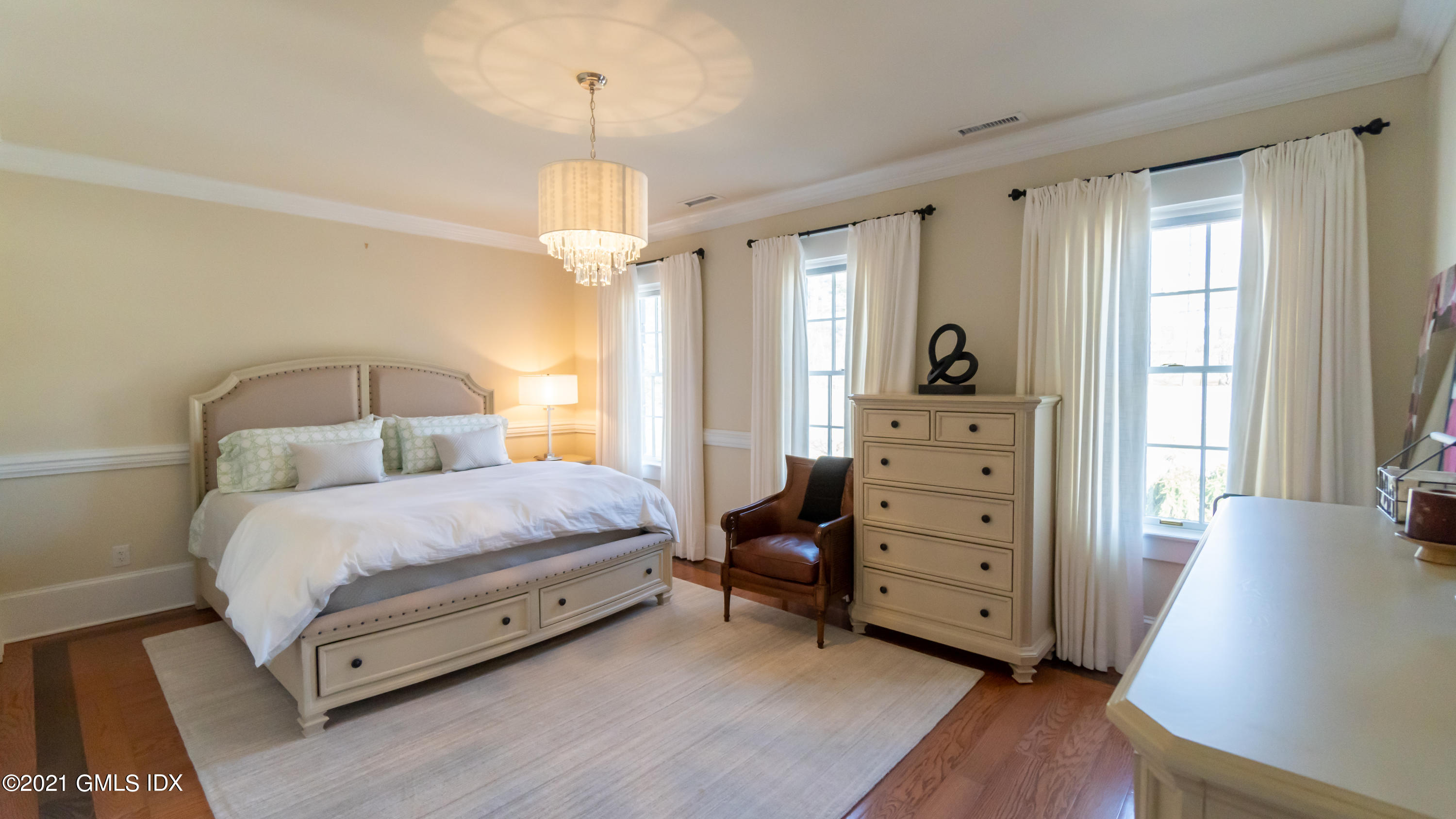 28 Dairy Road Greenwich, CT 06830 - Photo 17 of 23 a spacious bedroom with a bed and a dresser