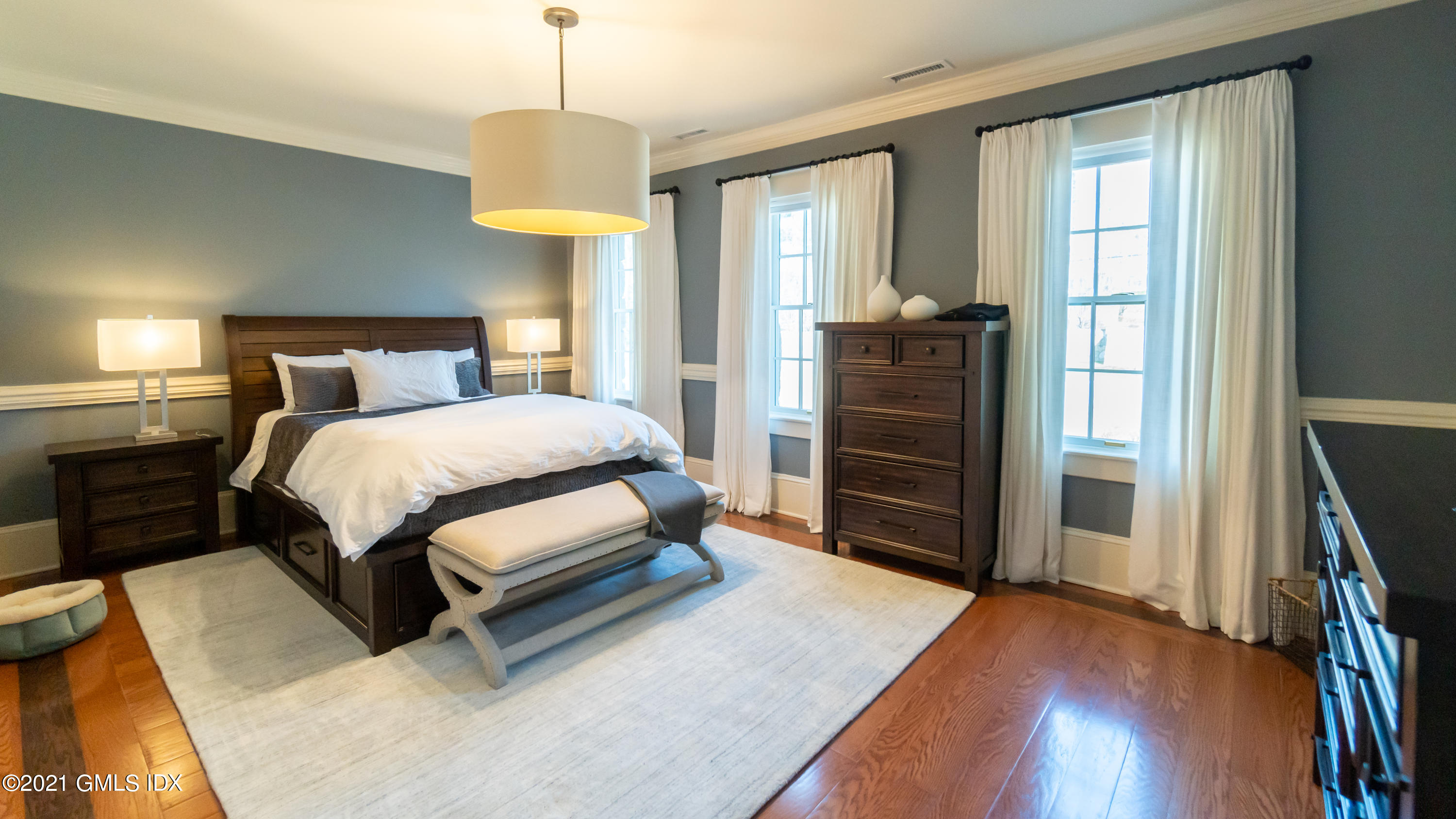 28 Dairy Road Greenwich, CT 06830 - Photo 18 of 23 a bedroom with a bed and a flat tv screen on a dresser