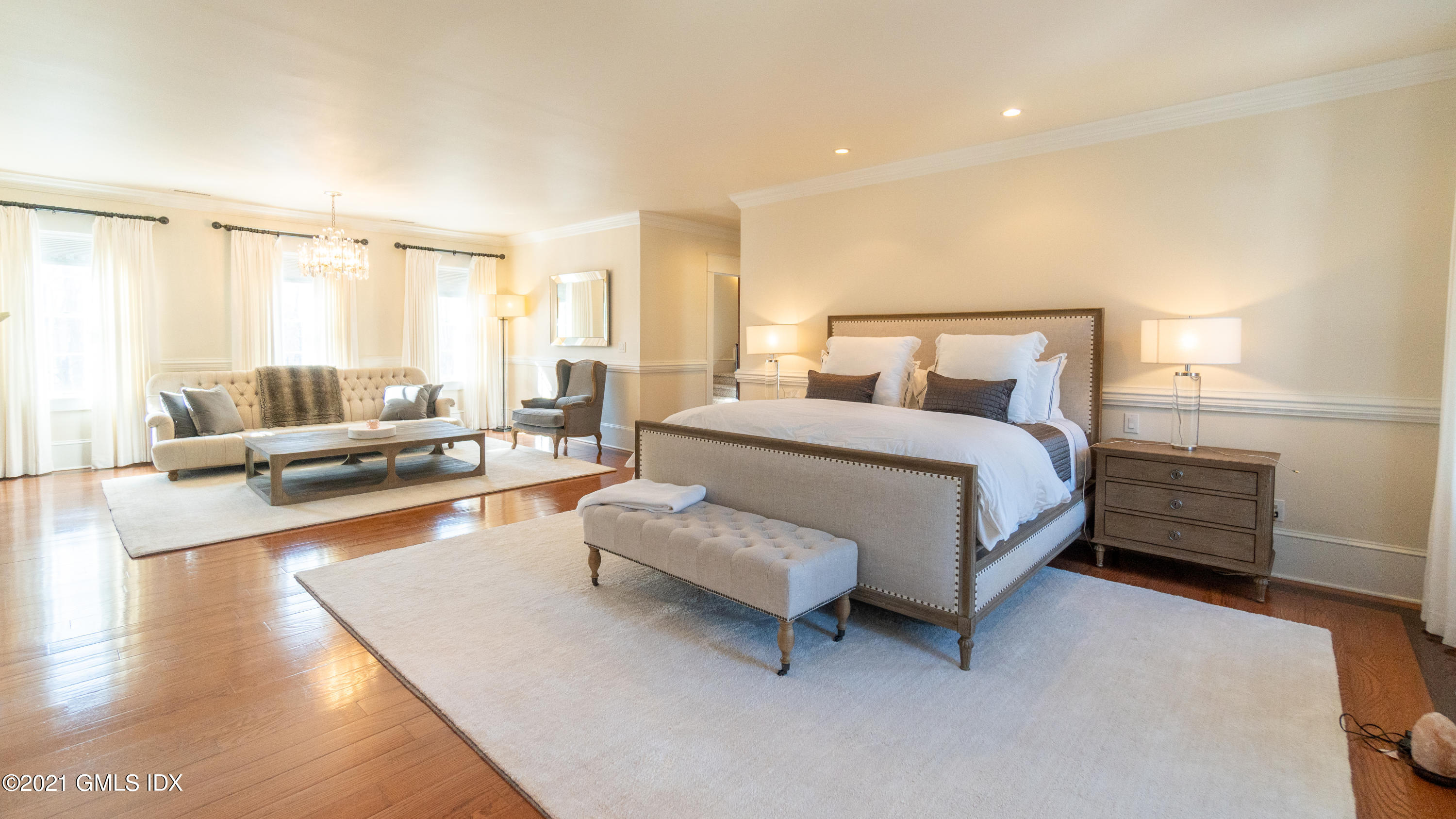 28 Dairy Road Greenwich, CT 06830 - Photo 20 of 23 a spacious bedroom with a bed and a couch